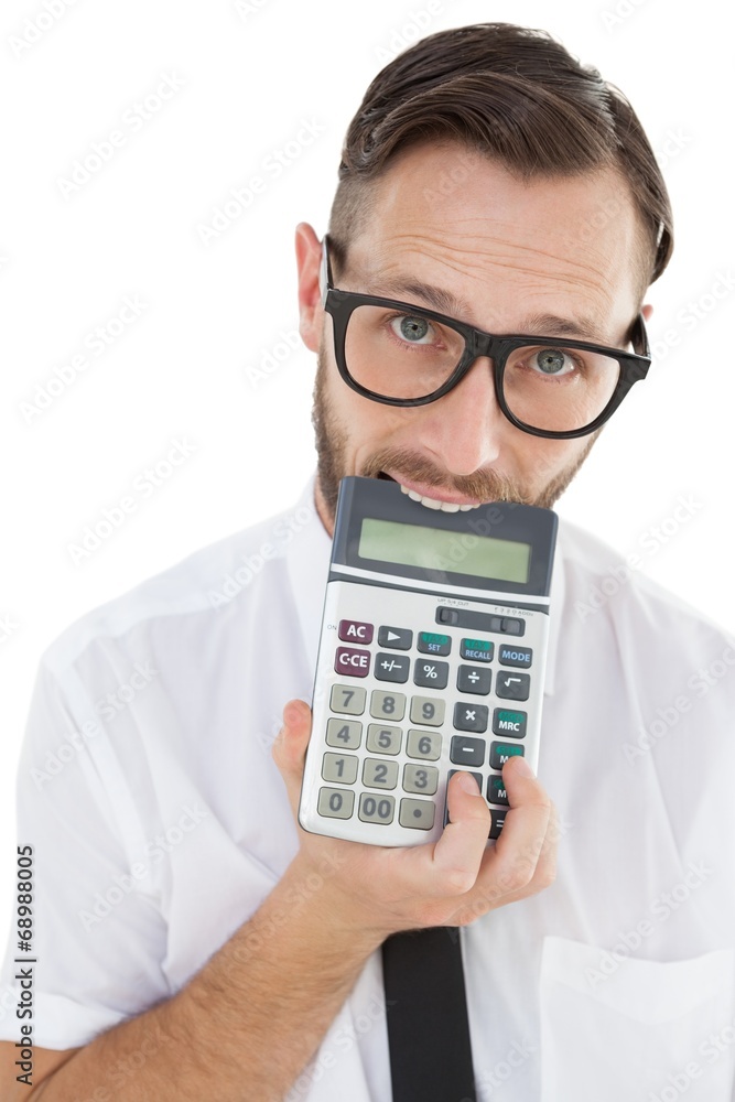 Nerdy excited businessman biting calculator Nerdy excited businessman biting calculator