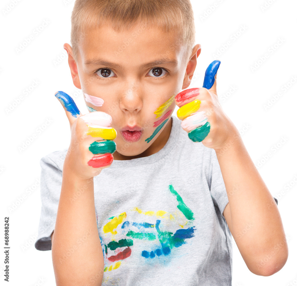 Portrait of a cute boy playing with paints Portrait of a cute boy playing with paints