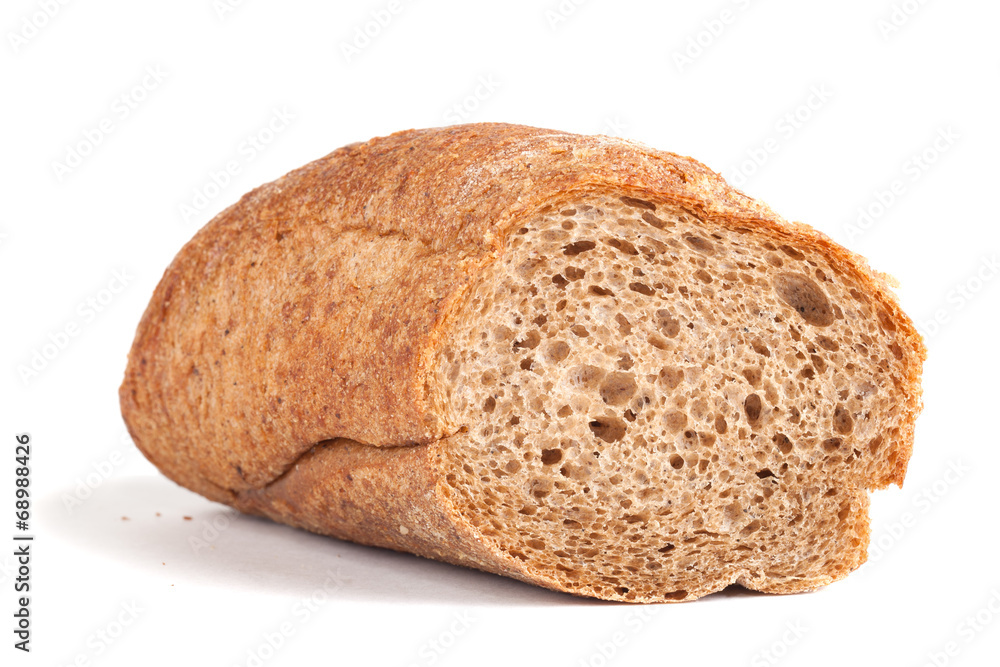 Sliced black baguette with crumbs isolated on white backgr Sliced black baguette with crumbs isolated on white backgr