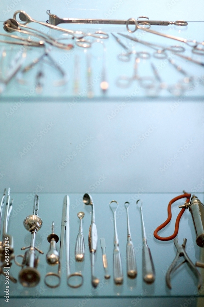 Collection of vintage dental instruments in glass cupboard Stock Photo