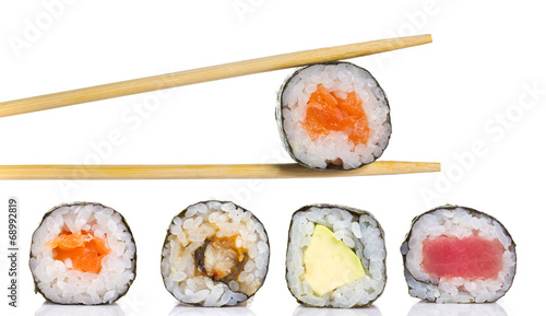 Little sushi maki roll with chopsticks