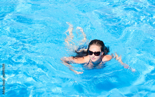 Young girl in the swimming pool