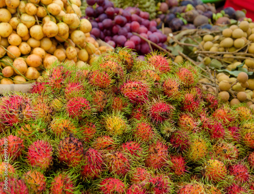 Sweet fruits rambutan in the market