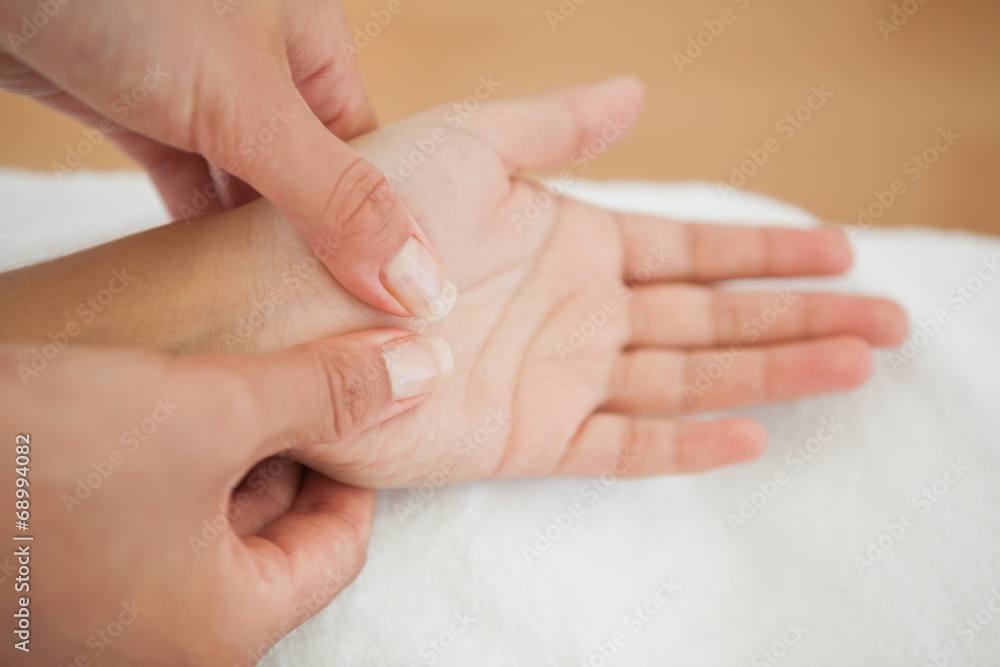 Woman receiving a hand massage Woman receiving a hand massage