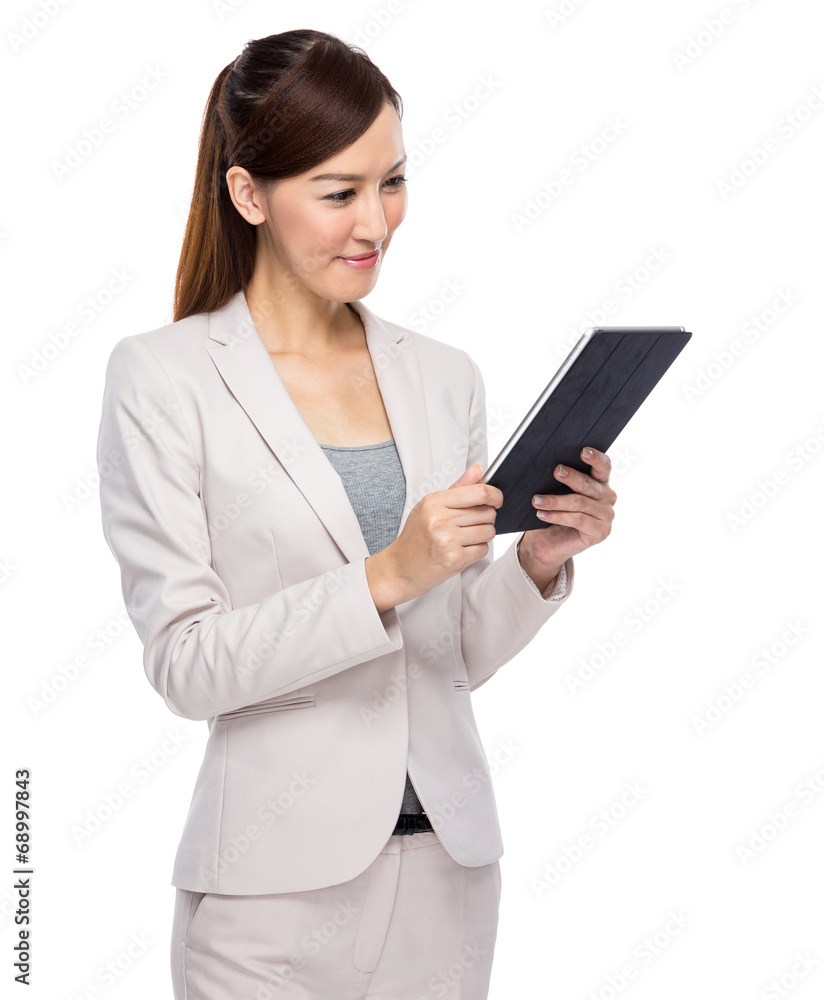 Businesswoman look at digital tablet Businesswoman look at digital tablet