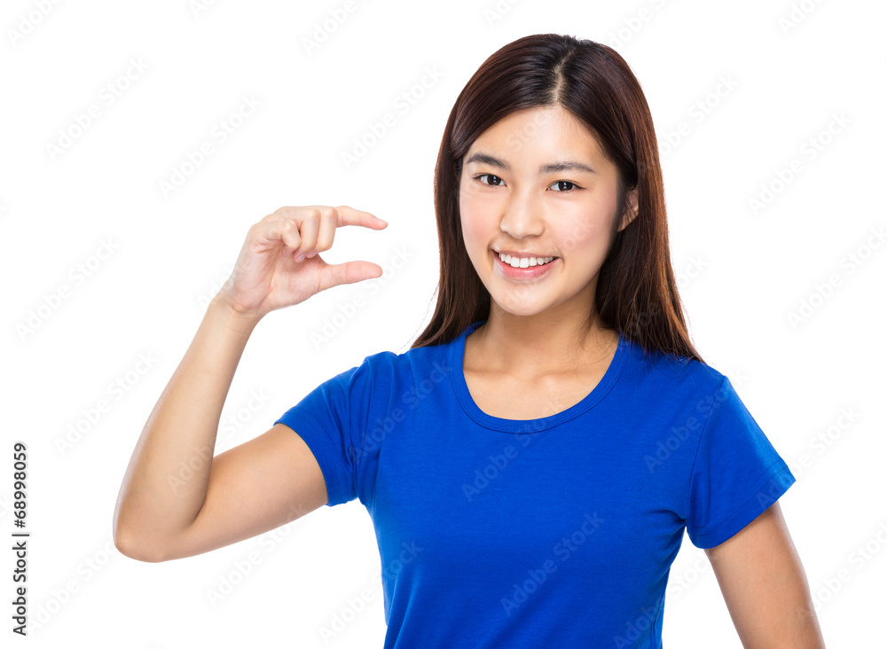 Woman with finger show small distance Woman with finger show small distance
