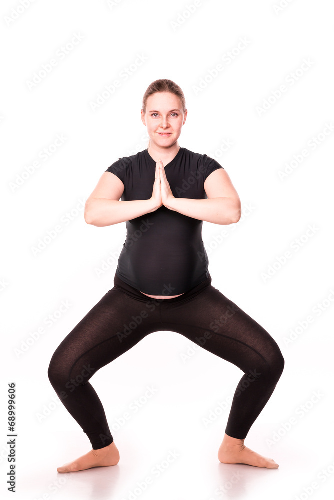 Pregnant woman exercising isolated on white Pregnant woman exercising isolated on white