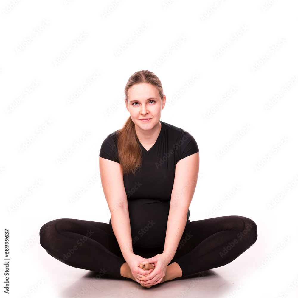 Pregnant woman exercising isolated on white Pregnant woman exercising isolated on white