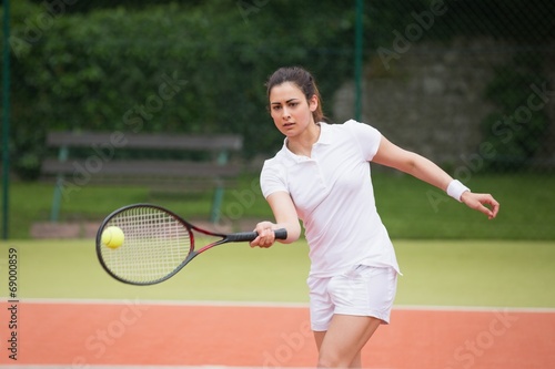 Tennis player playing on the court © WavebreakmediaMicro