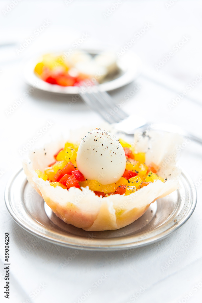Hard boiled quail eggs with capsicum in cheese basket Hard boiled quail eggs with capsicum in cheese basket