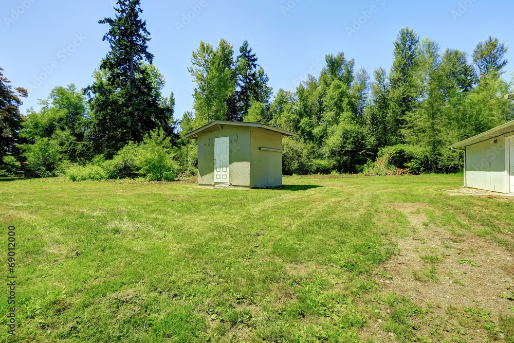 Countryside landscape. Backyard with small shed