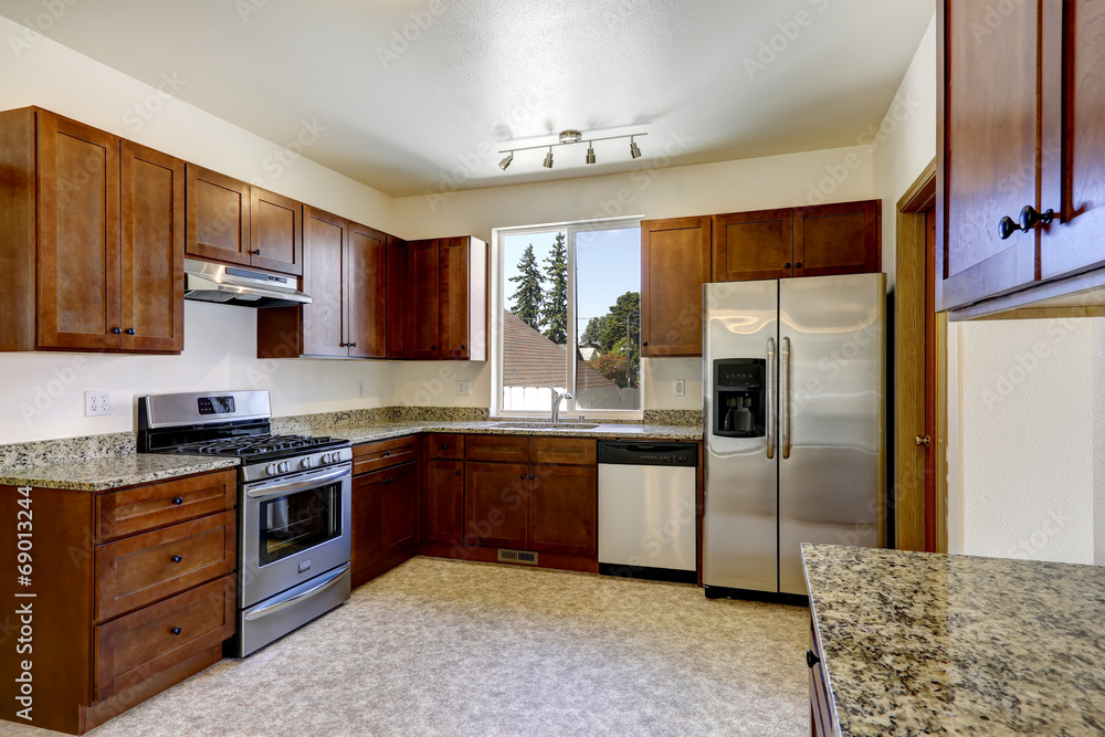 Kitchen cabinets with granite tops and ss-appliances