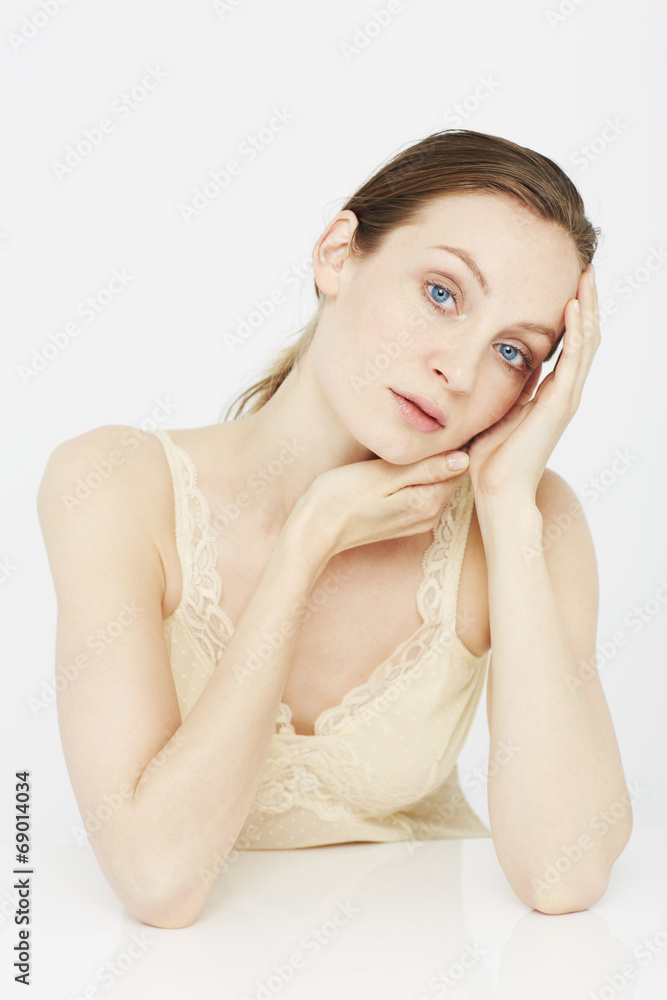 Portrait of young woman in lace camisole