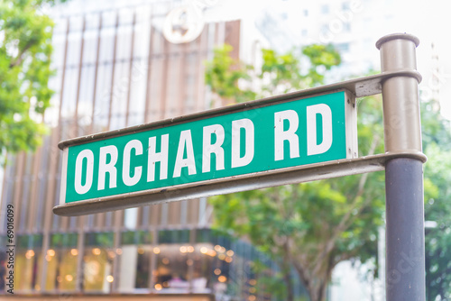 street sign that read " Orchard Road" © siraphol