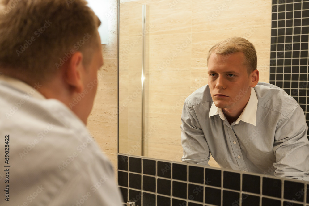 Fototapeta premium Man with hangover in a bathroom