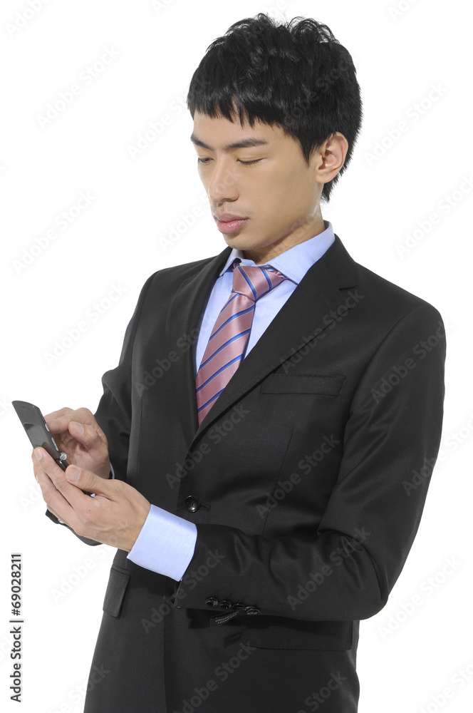 Portrait of handsome young business man using cell phone Portrait of handsome young business man using cell phone