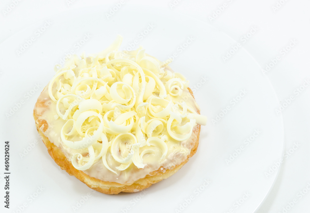 Donut on white dish close up Donut on white dish close up