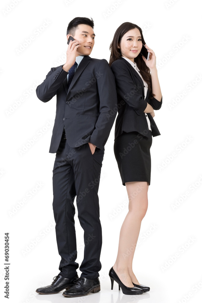 Asian business man and woman take a call Asian business man and woman take a call