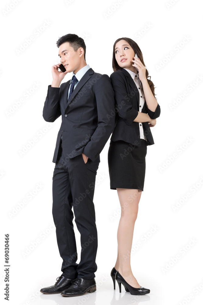 Asian business man and woman take a call Asian business man and woman take a call