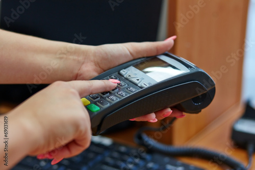 Woman pay by credit card