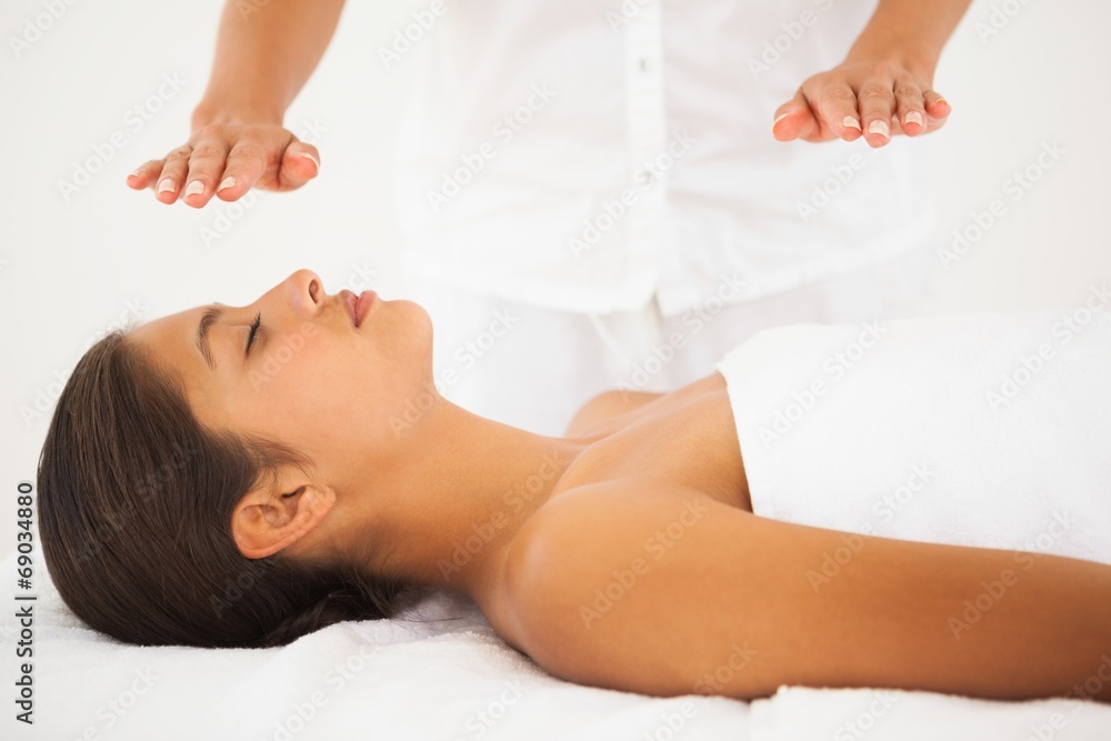 Beautiful brunette getting reiki therapy Beautiful brunette getting reiki therapy