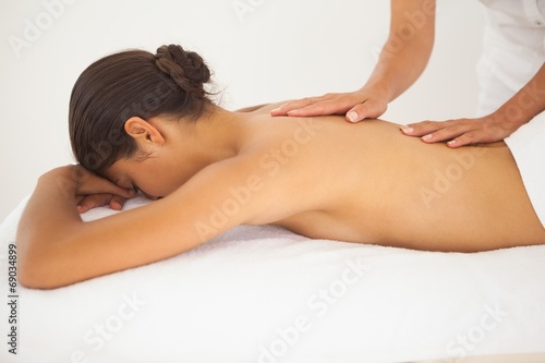 Beautiful brunette enjoying a back massage