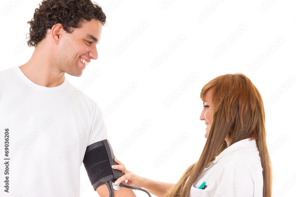 Obraz premium nurse or doctor measures the blood pressure of a satisfied and s