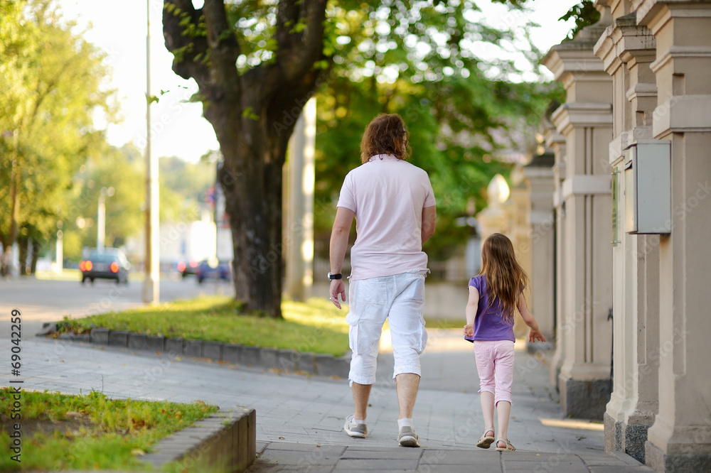 Father and daughter having a walk