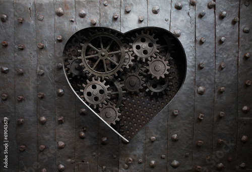 heart hole in old metal with gears and cogs