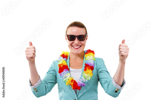 woman with garland on neck with thumbs up smiling photo