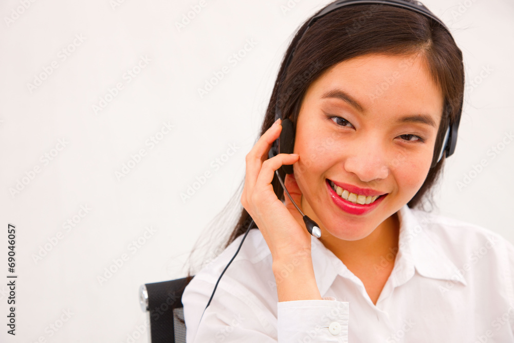 Close-up of a young smiling female customer service executive Close-up of a young smiling female customer service executive
