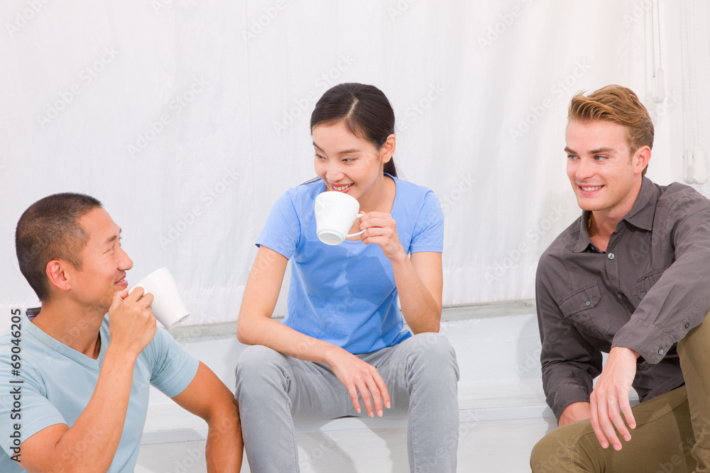Multi ethnic people having coffee together Multi ethnic people having coffee together