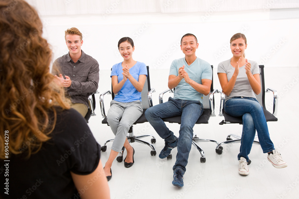 Fototapeta premium Executives sitting in seminar applauding