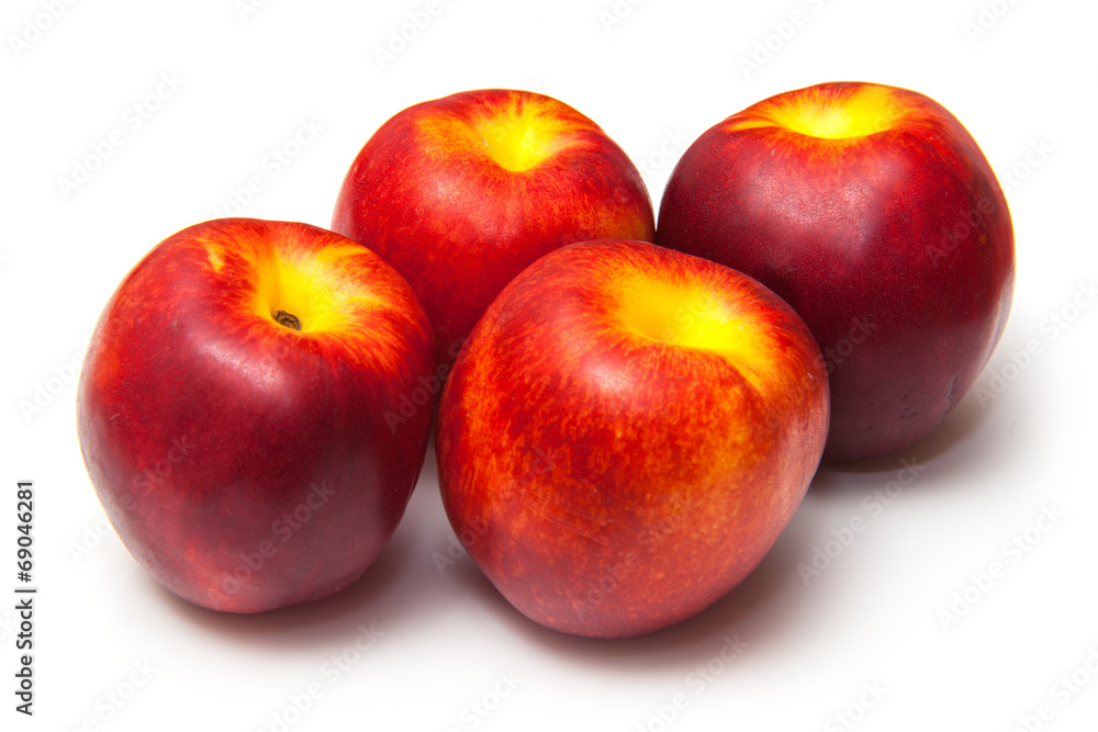.Nectarines isolated on a white studio background. .Nectarines isolated on a white studio background.