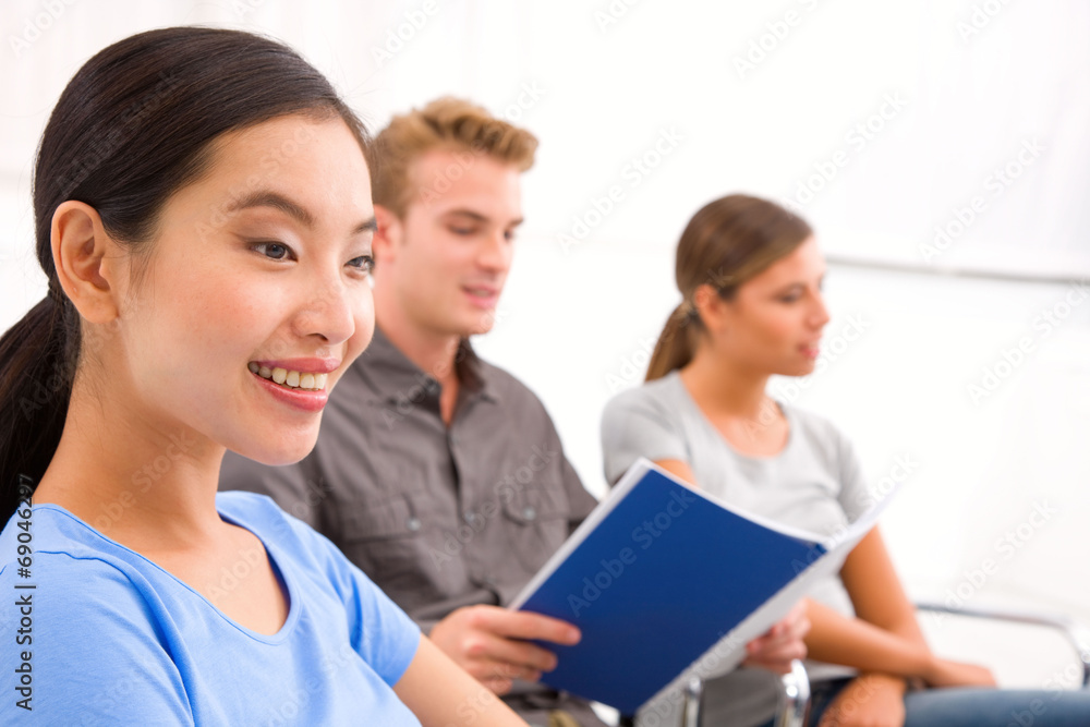 Happy businesswoman with her colleagues in office Happy businesswoman with her colleagues in office