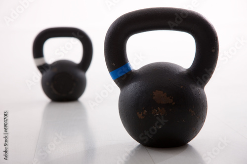 Fototapeta Naklejka Na Ścianę i Meble -  Kettlebells weights in a workout gym