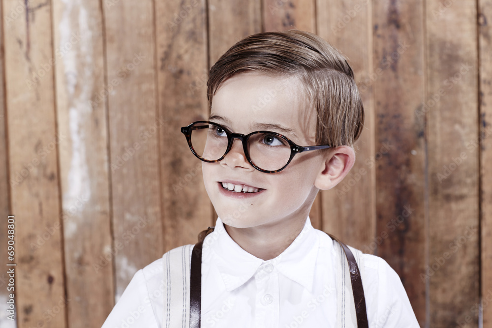 Young boy wearing spectacles, looking away. Young boy wearing spectacles, looking away.