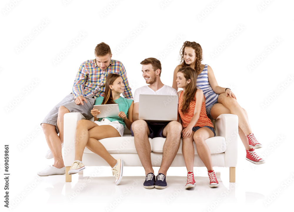 Group of young people on sofa with tablet Group of young people on sofa with tablet