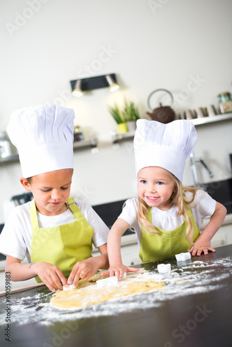 happy children kids family preparing funny cake kitchen at home