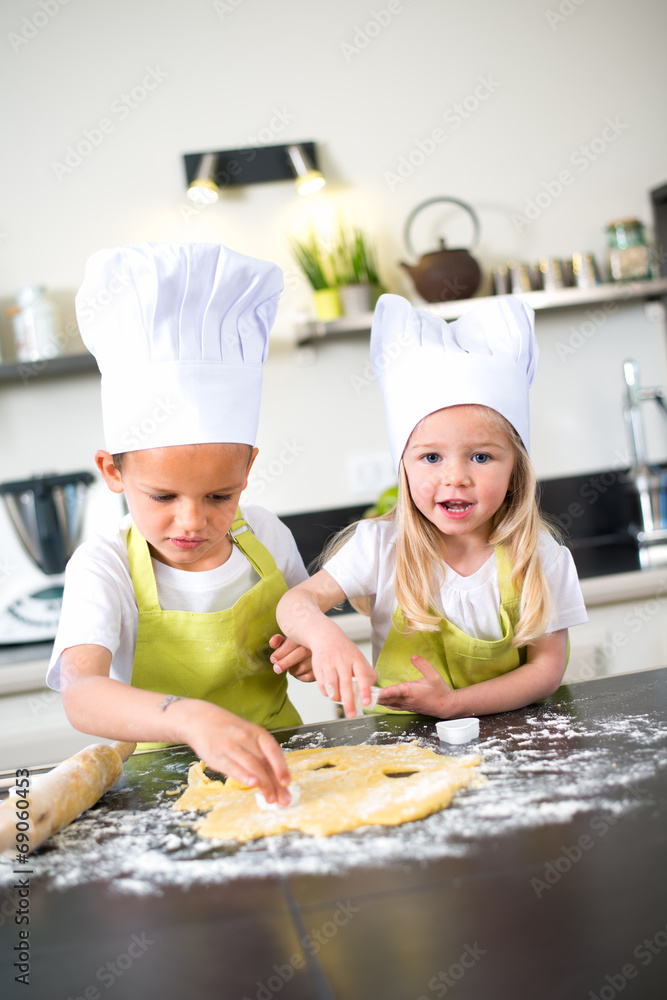 happy children kids family preparing funny cake kitchen at home