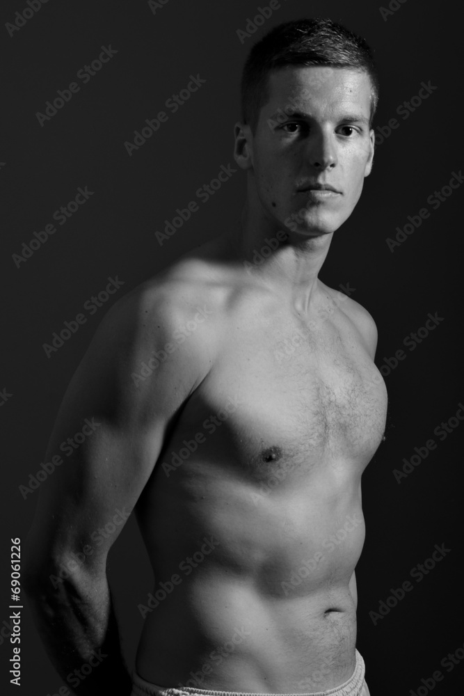 Fototapeta premium Young male model posing with bare chest