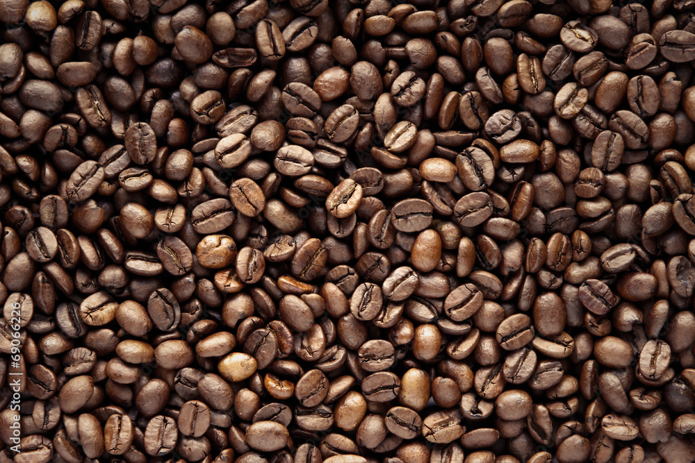 Close-up of roasted brown coffee beans background