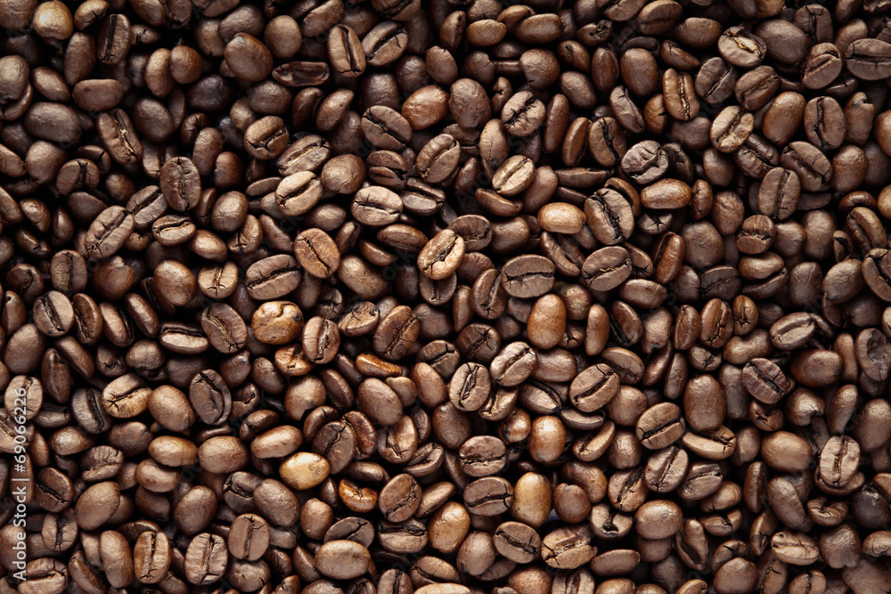 Close-up of roasted brown coffee beans background Close-up of roasted brown coffee beans background