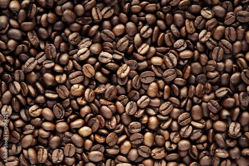 Close-up of roasted brown coffee beans background