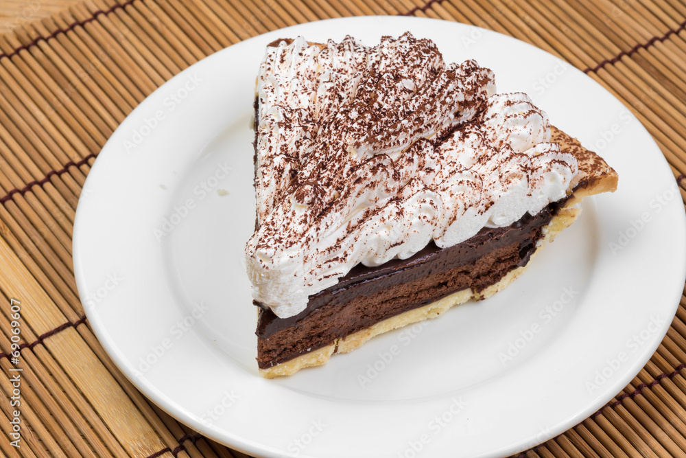 Chocolate Tart with cream and cocoa powder on the top Chocolate Tart with cream and cocoa powder on the top