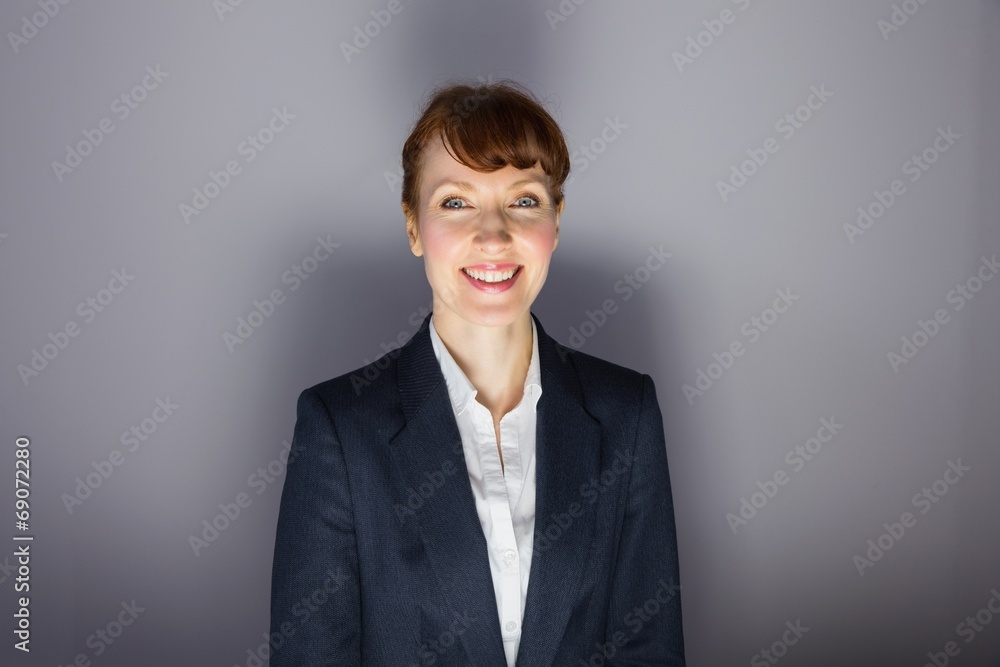 Businesswoman in suit smiling at camera Businesswoman in suit smiling at camera