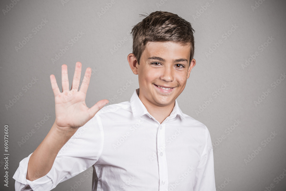 Handsome teenager showing 5 fingers palm, number five gesture Handsome teenager showing 5 fingers palm, number five gesture