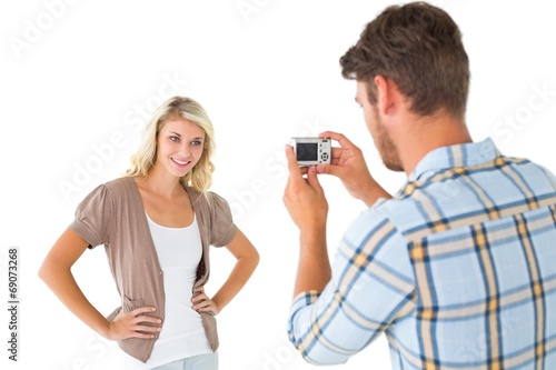 Man taking photo of his pretty girlfriend