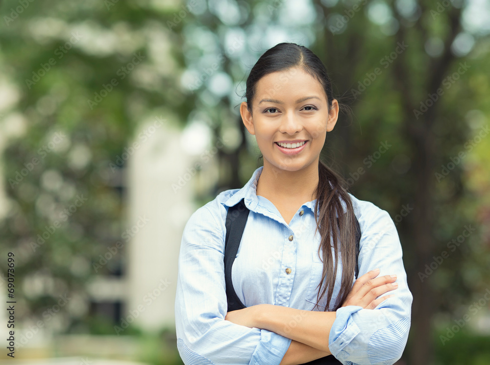 Confident young business woman outside corporate office Confident young business woman outside corporate office