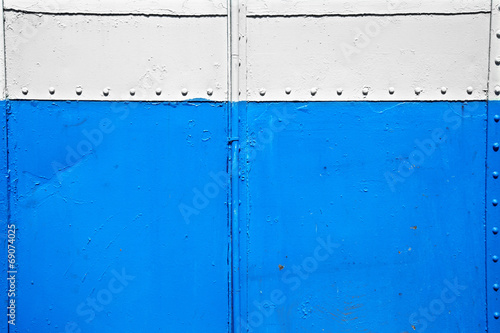 close up old blue and white metal wall © seksanwangjaisuk